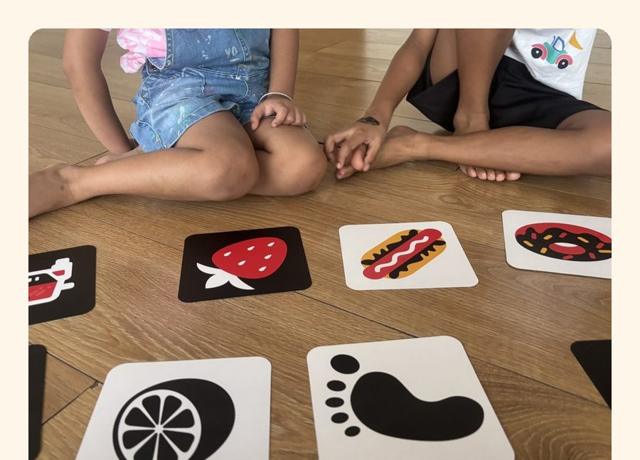 Children sitting in a circle around story cards